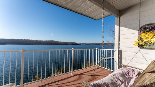 balcony featuring a water view