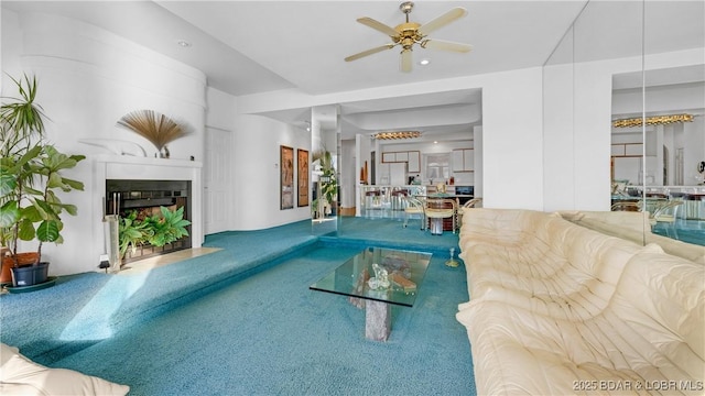 757 Malibu Rd Unit A101, Osage Beach, MO 65065 - living area featuring a ceiling fan, carpet flooring, a fireplace with flush hearth, and recessed lighting