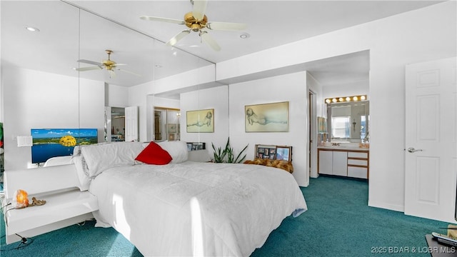 bedroom with ceiling fan, connected bathroom, and dark carpet