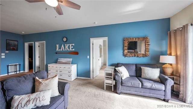 living room with light carpet and ceiling fan