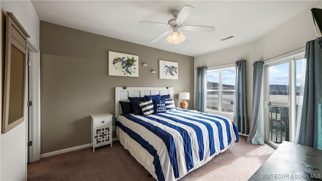 bedroom featuring ceiling fan and dark colored carpet