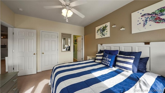 carpeted bedroom featuring ceiling fan