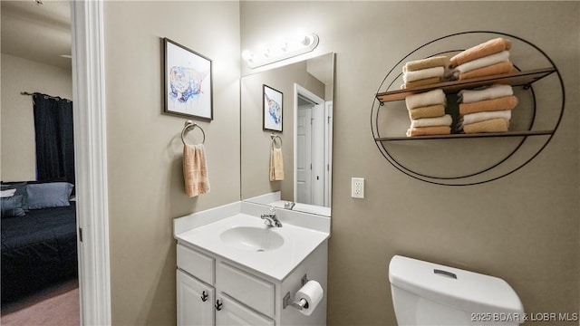 bathroom with vanity and toilet