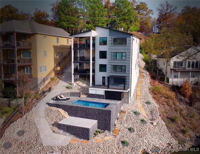 exterior space with an in ground hot tub