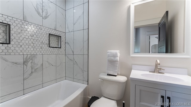 full bathroom with vanity, toilet, and tiled shower / bath combo