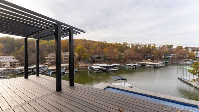 dock area featuring a water view and a pergola