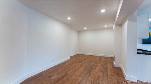 unfurnished room with dark hardwood / wood-style floors