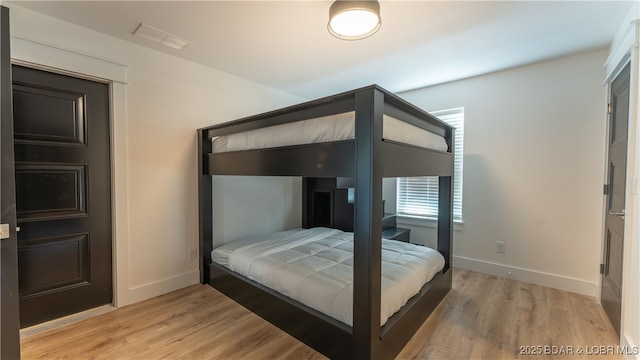 bedroom featuring light wood-type flooring