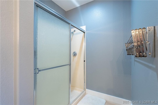 bathroom with a stall shower