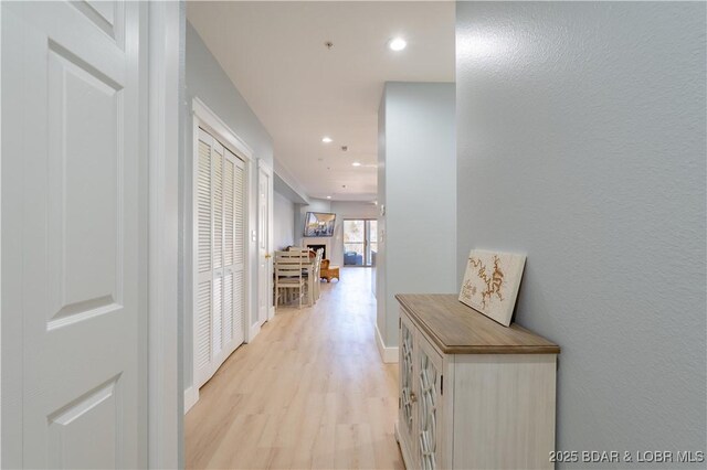 hallway featuring light hardwood / wood-style floors