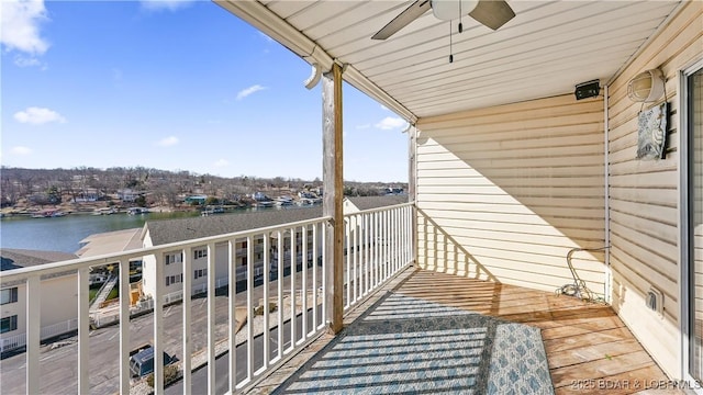 balcony with a water view and ceiling fan