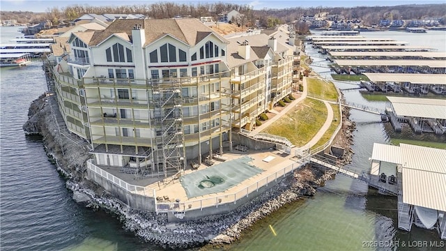 birds eye view of property featuring a water view