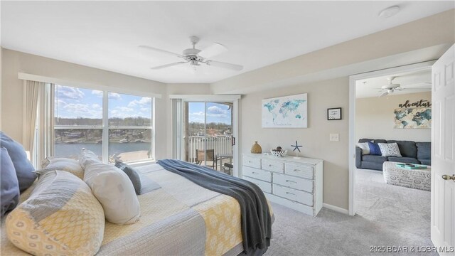 1481 Ledges Dr Unit C23, Osage Beach, MO 65065 - bedroom with access to exterior, light colored carpet, a water view, ceiling fan, and baseboards