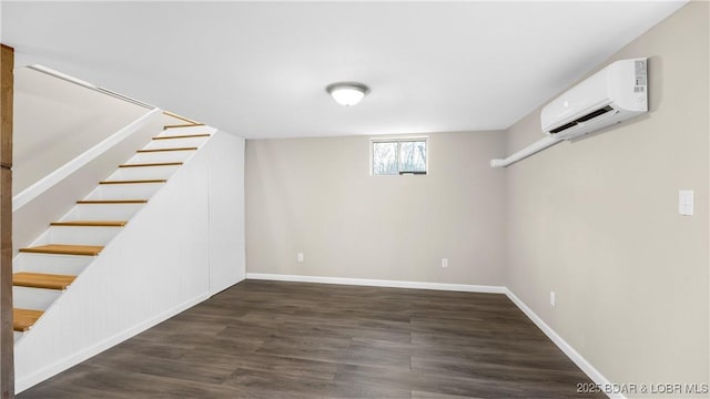 27436 Eola Ln, Rocky Mount, MO 65072 - basement with an AC wall unit and dark hardwood / wood-style floors