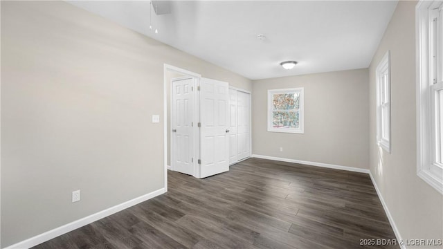 27436 Eola Ln, Rocky Mount, MO 65072 - unfurnished bedroom with dark wood-type flooring and ceiling fan