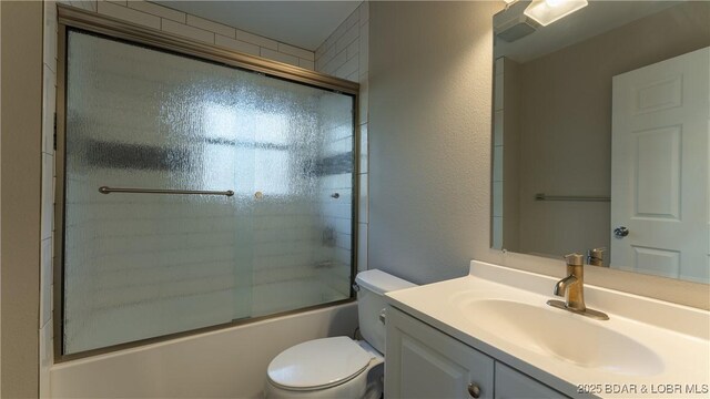 27436 Eola Ln, Rocky Mount, MO 65072 - full bathroom featuring vanity, shower / bath combination with glass door, and toilet