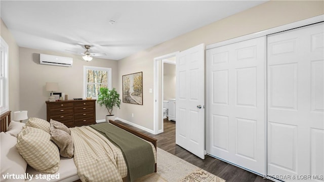 27436 Eola Ln, Rocky Mount, MO 65072 - bedroom featuring dark wood-type flooring, a wall mounted air conditioner, ceiling fan, and a closet