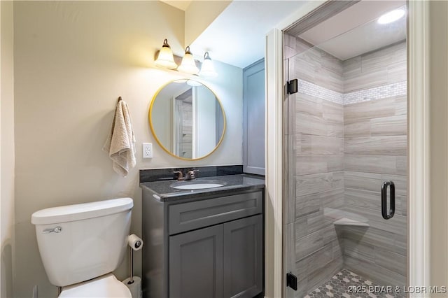 bathroom with vanity, toilet, and walk in shower