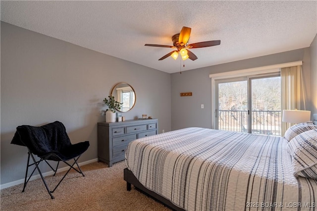 carpeted bedroom featuring ceiling fan, access to outside, and a textured ceiling