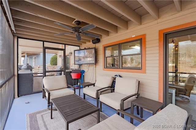 view of patio featuring ceiling fan, an outdoor living space, and grilling area