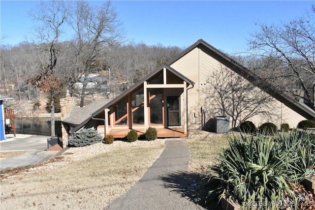 view of front of home with a sunroom