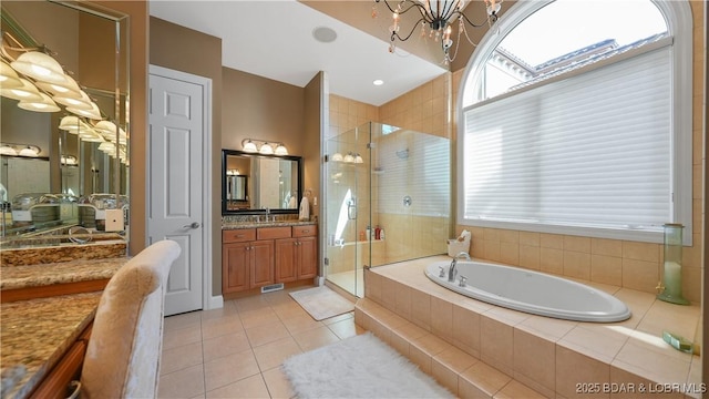 bathroom featuring vanity, separate shower and tub, plenty of natural light, and tile patterned floors