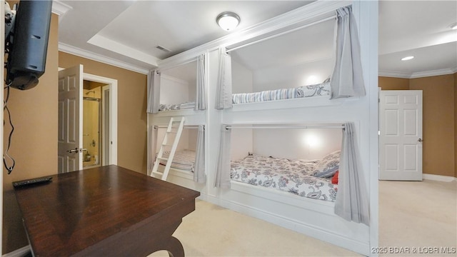 carpeted bedroom featuring crown molding