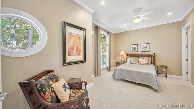 carpeted bedroom with crown molding and ceiling fan