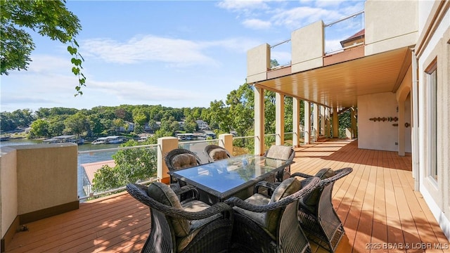 wooden deck featuring a water view