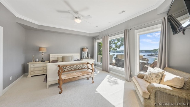 carpeted bedroom featuring a water view, ceiling fan, and ornamental molding