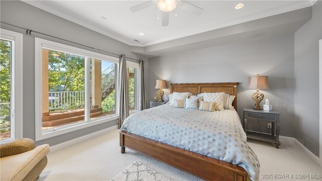 bedroom with crown molding, light colored carpet, and ceiling fan