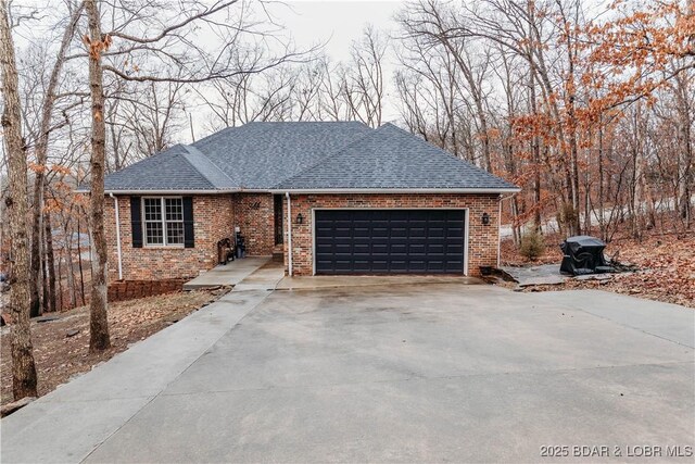 ranch-style home featuring a garage