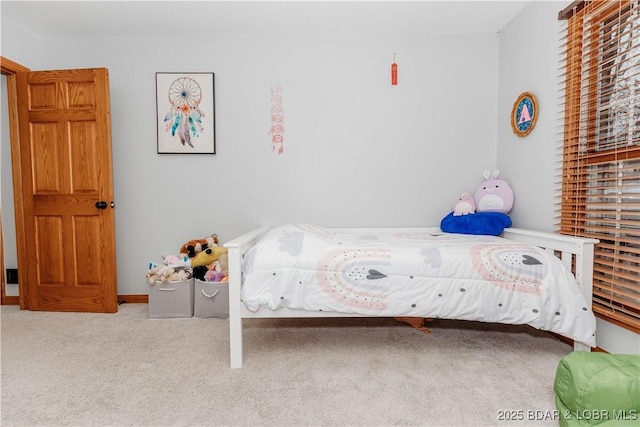 unfurnished bedroom featuring light carpet