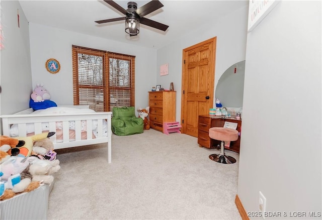 carpeted bedroom with ceiling fan