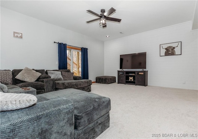 carpeted living room with ceiling fan