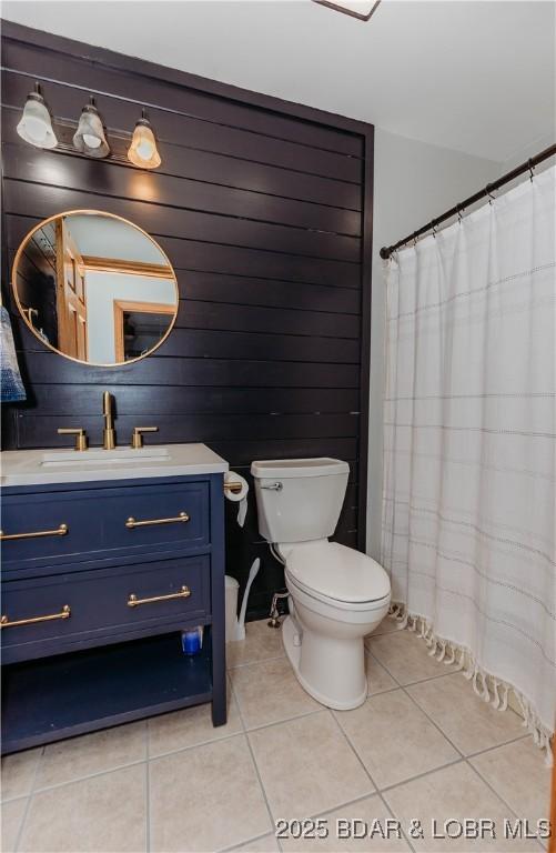 bathroom with vanity, tile patterned floors, and toilet