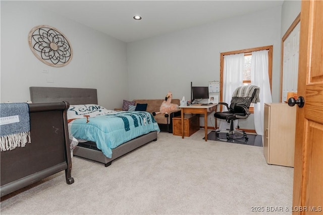 bedroom featuring light colored carpet