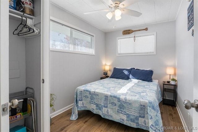 bedroom featuring hardwood / wood-style flooring and ceiling fan