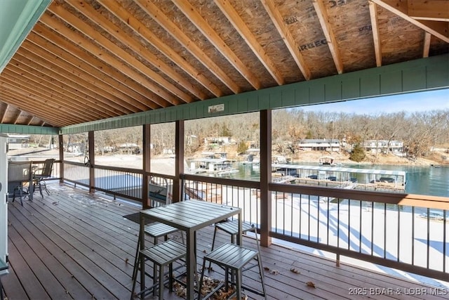 dock area featuring a deck with water view