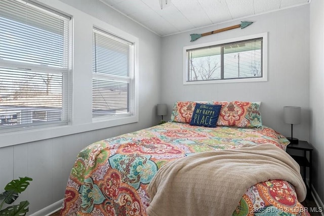 bedroom with multiple windows