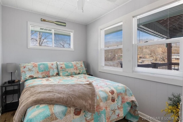 bedroom with hardwood / wood-style floors