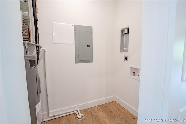 clothes washing area featuring light wood-type flooring, electric panel, electric water heater, hookup for a washing machine, and hookup for an electric dryer