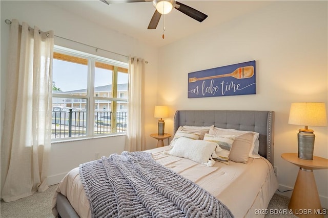 bedroom featuring ceiling fan and carpet