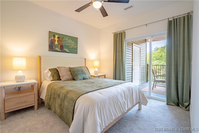 carpeted bedroom with access to outside, ceiling fan, and vaulted ceiling