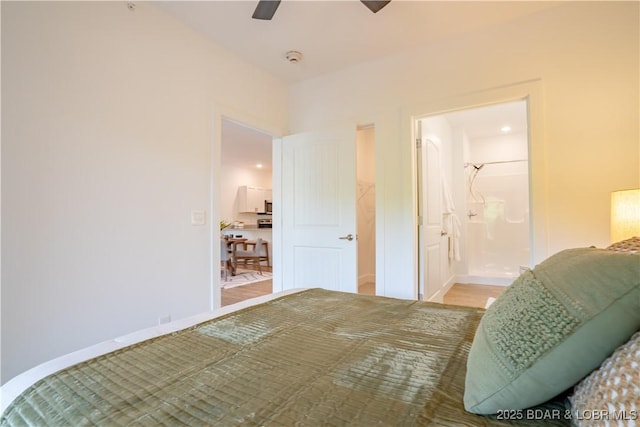 bedroom featuring ceiling fan and ensuite bath