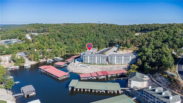 birds eye view of property with a water view