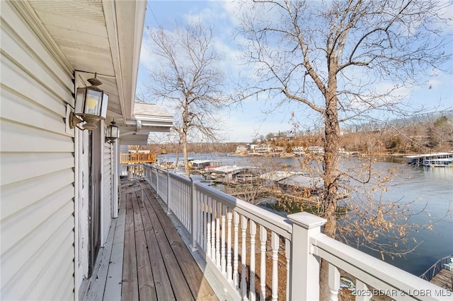 wooden deck with a water view