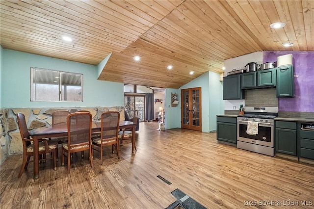 kitchen with vaulted ceiling, light hardwood / wood-style floors, stainless steel range with gas cooktop, wooden ceiling, and french doors