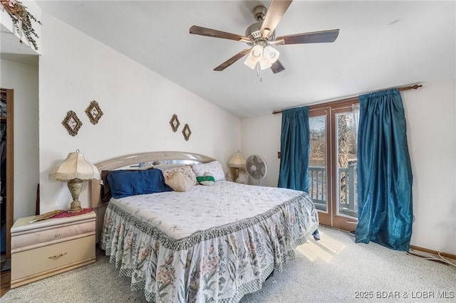 carpeted bedroom with vaulted ceiling, access to outside, and ceiling fan