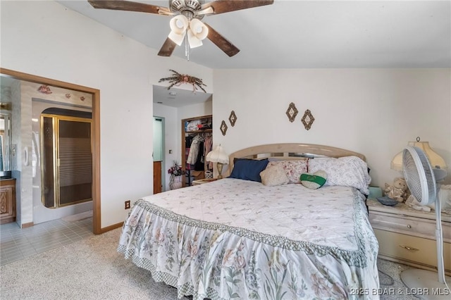 carpeted bedroom with ceiling fan and a closet